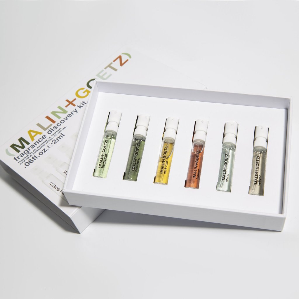 White gift box opened to reveal 6 MALIN and GOETZ fragrance samples.